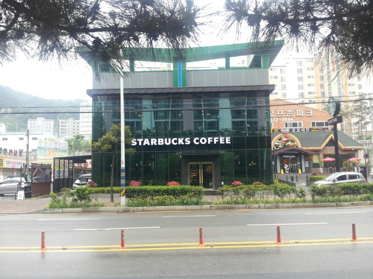 The newest Starbucks to open near my home in Gimhae. What can I say? It's Starbucks. In Korea, if you want a drip coffee and milk, good luck. It's all about Americano (espresso poured into hot water. Sometimes passable, often coffee-flavored water). Starbucks is one of the few places to have drip coffee, although you will usually need to ask for it and then wait a few minutes, as it's never ready to go. They also are the only place I've seen to have milk at the ready, but more often than not the containers are nearly empty. That said, it's some of the best coffee you can get in Korea.
